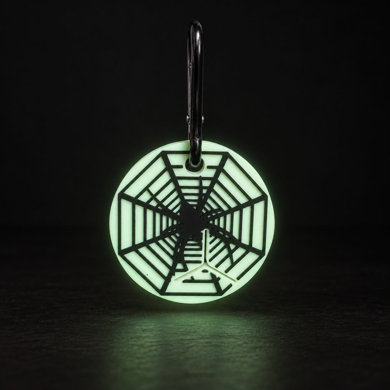 Glow-in-the-Dark Spiderweb Poo Bag Clip glowing in the dark | Dolly & Co